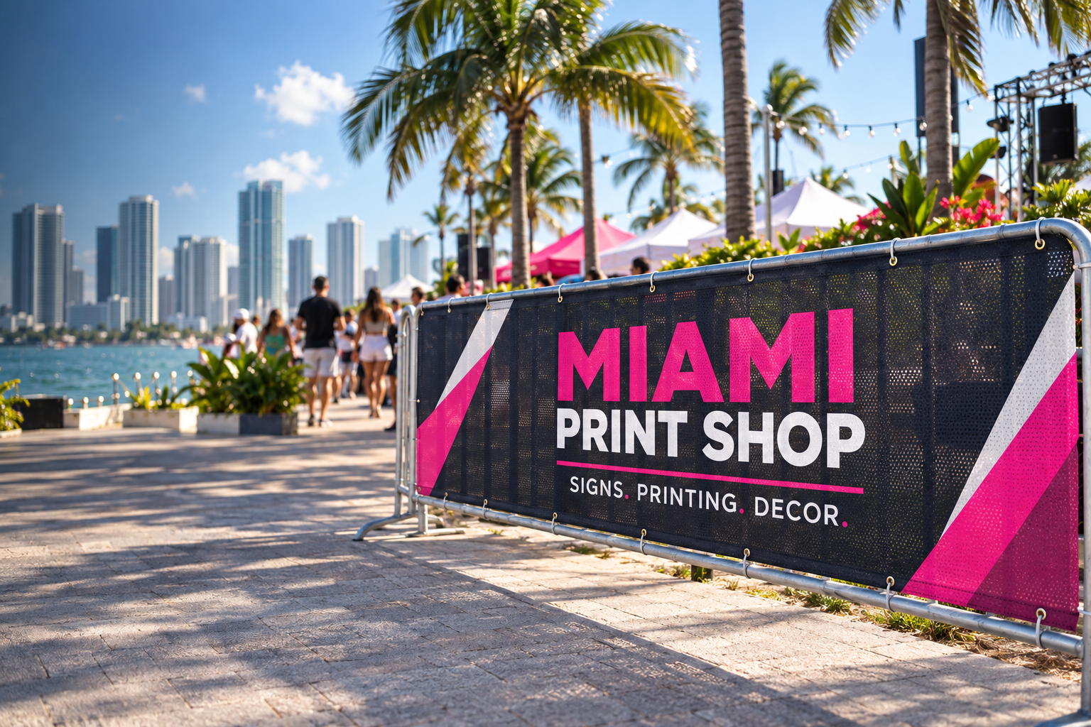 Miami Print Shop mesh banner at an outdoor Miami waterfront event